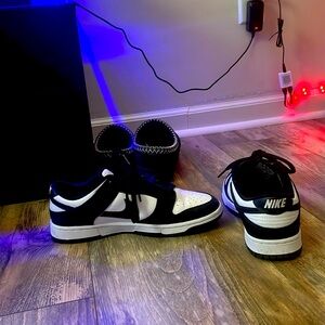 Panda Dunks slightly worn with creases, no longer in use.